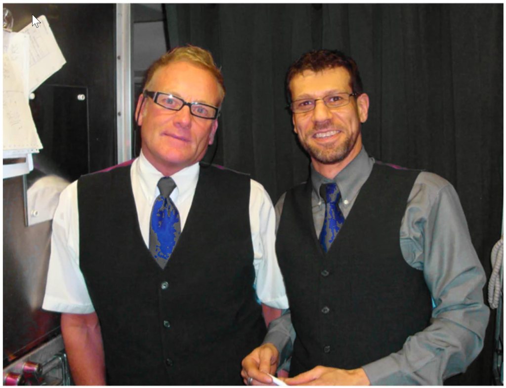 two male flight attendants in the galley