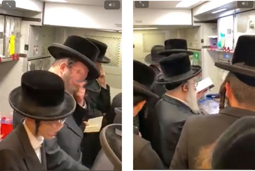 Orthodox Jewish men saying prayers in an aircraft galley